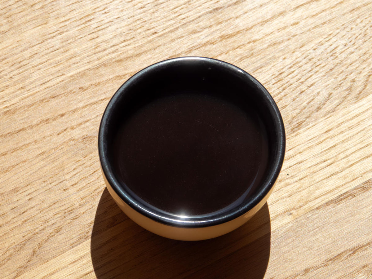 Titelbild Cup of Excellence mit Cuppingbecher
